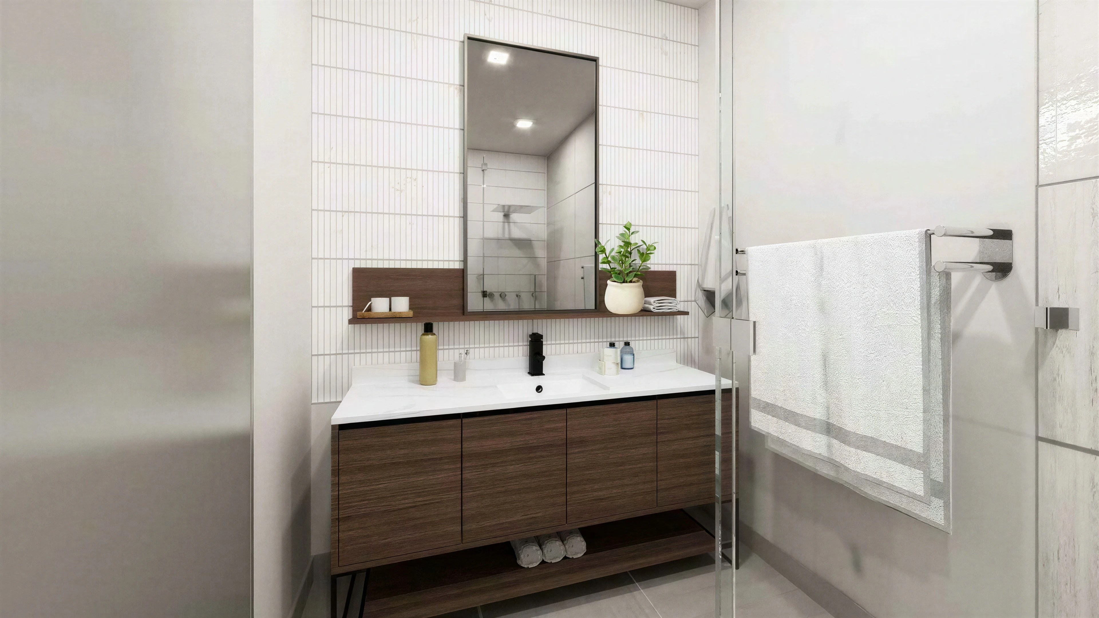 Bathroom vanity beneath a broad framed mirror.