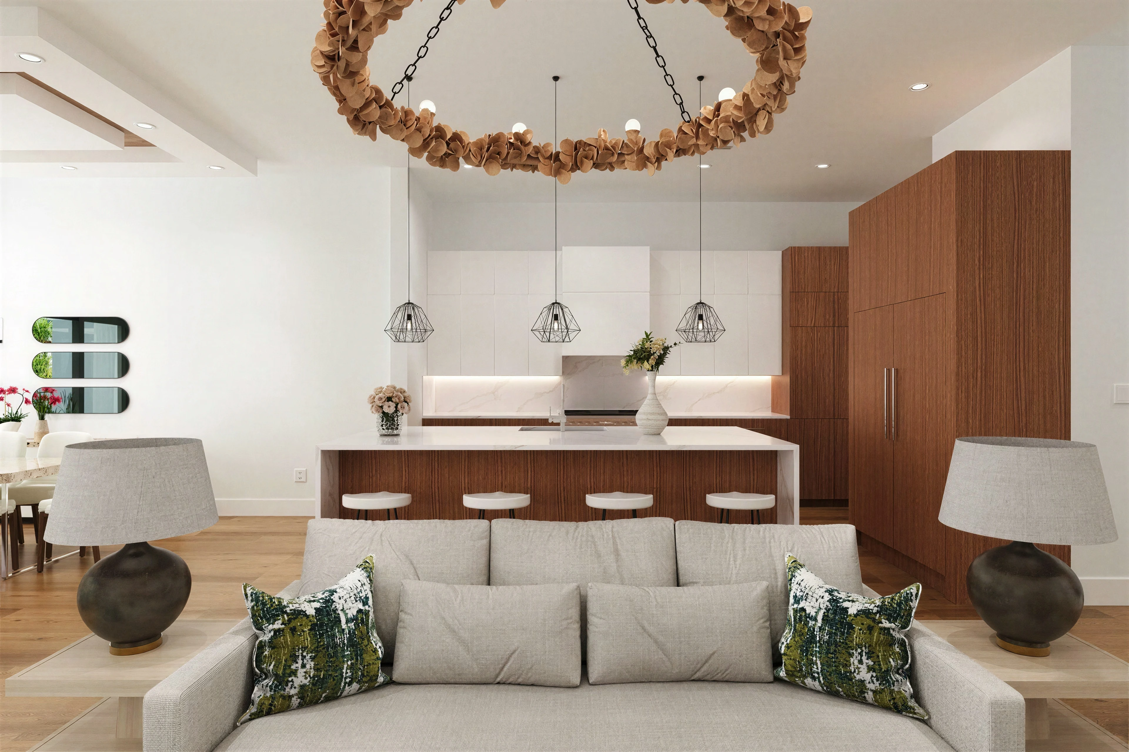 Dining table beneath a circular chandelier.
