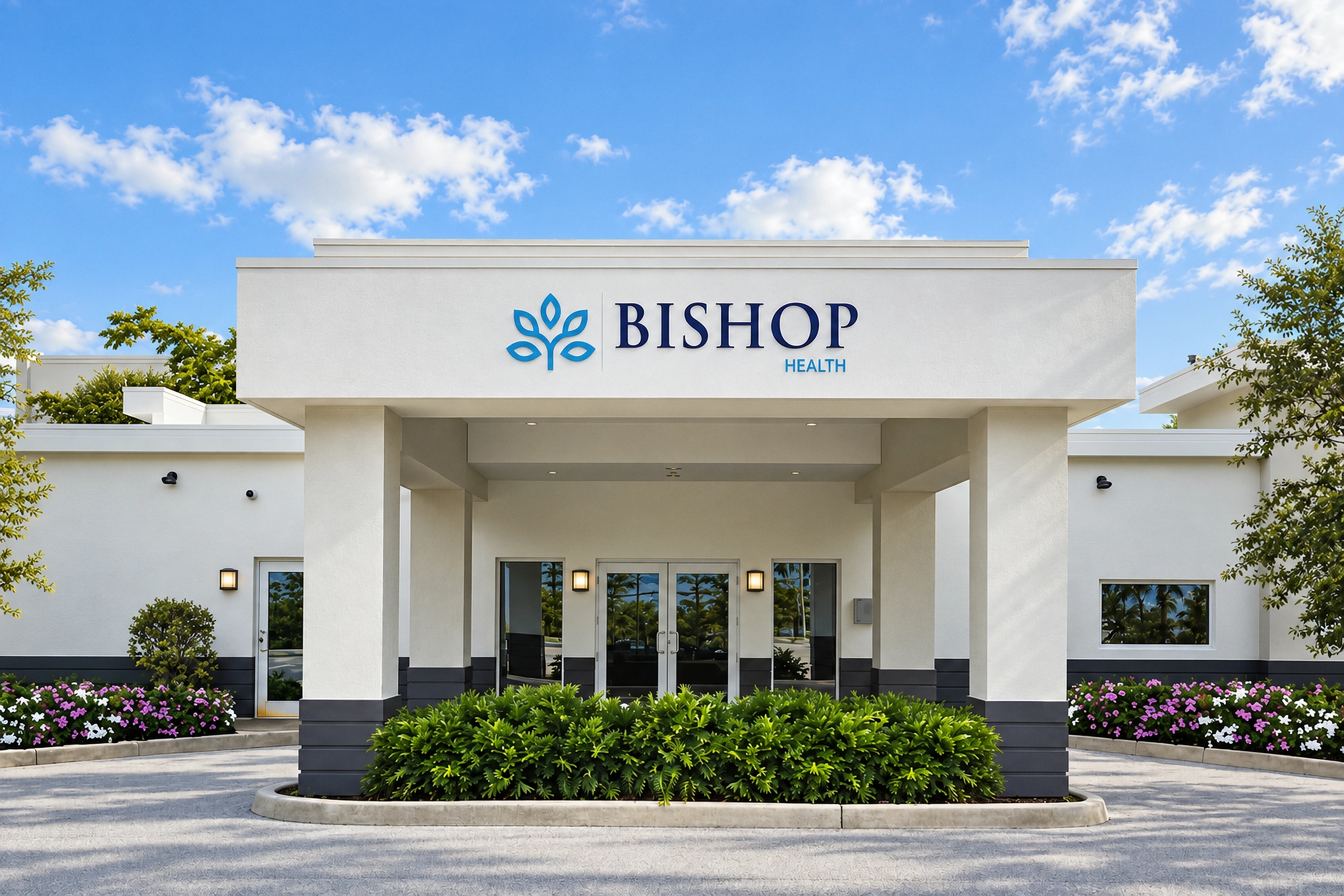 Bishop Health entrance with its white facade, original signage and planted landscape beds.
