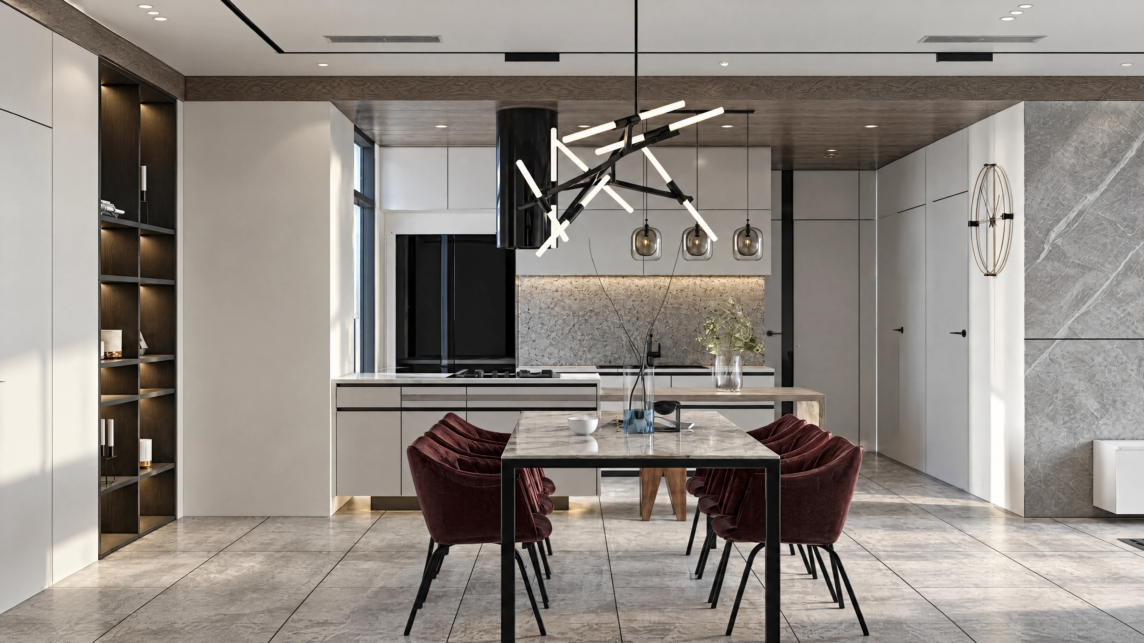 Dining table beneath a sculptural light fixture.
