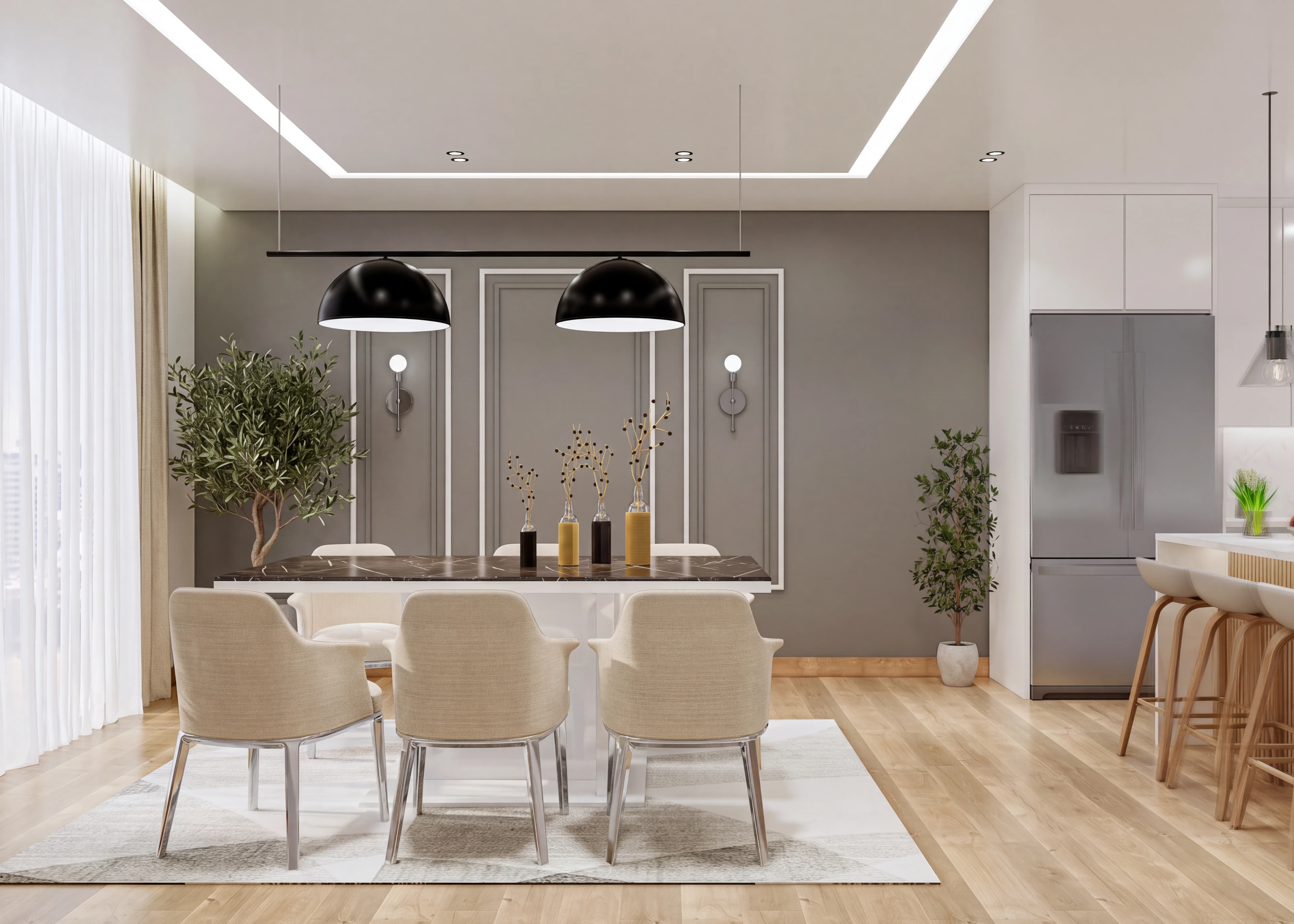 Dining table beneath paired pendants beside the kitchen.