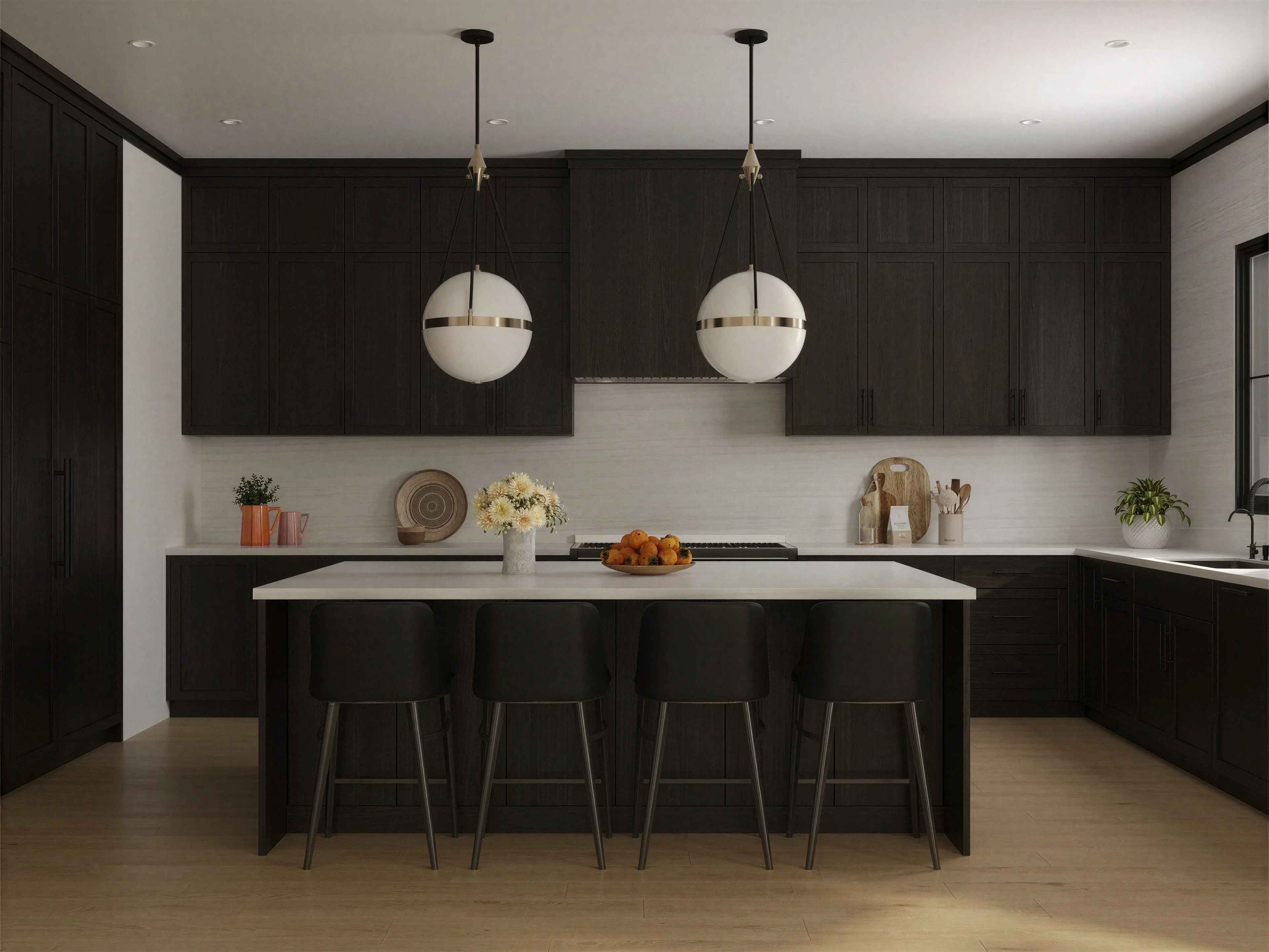 Kitchen island beneath two round pendant lights.