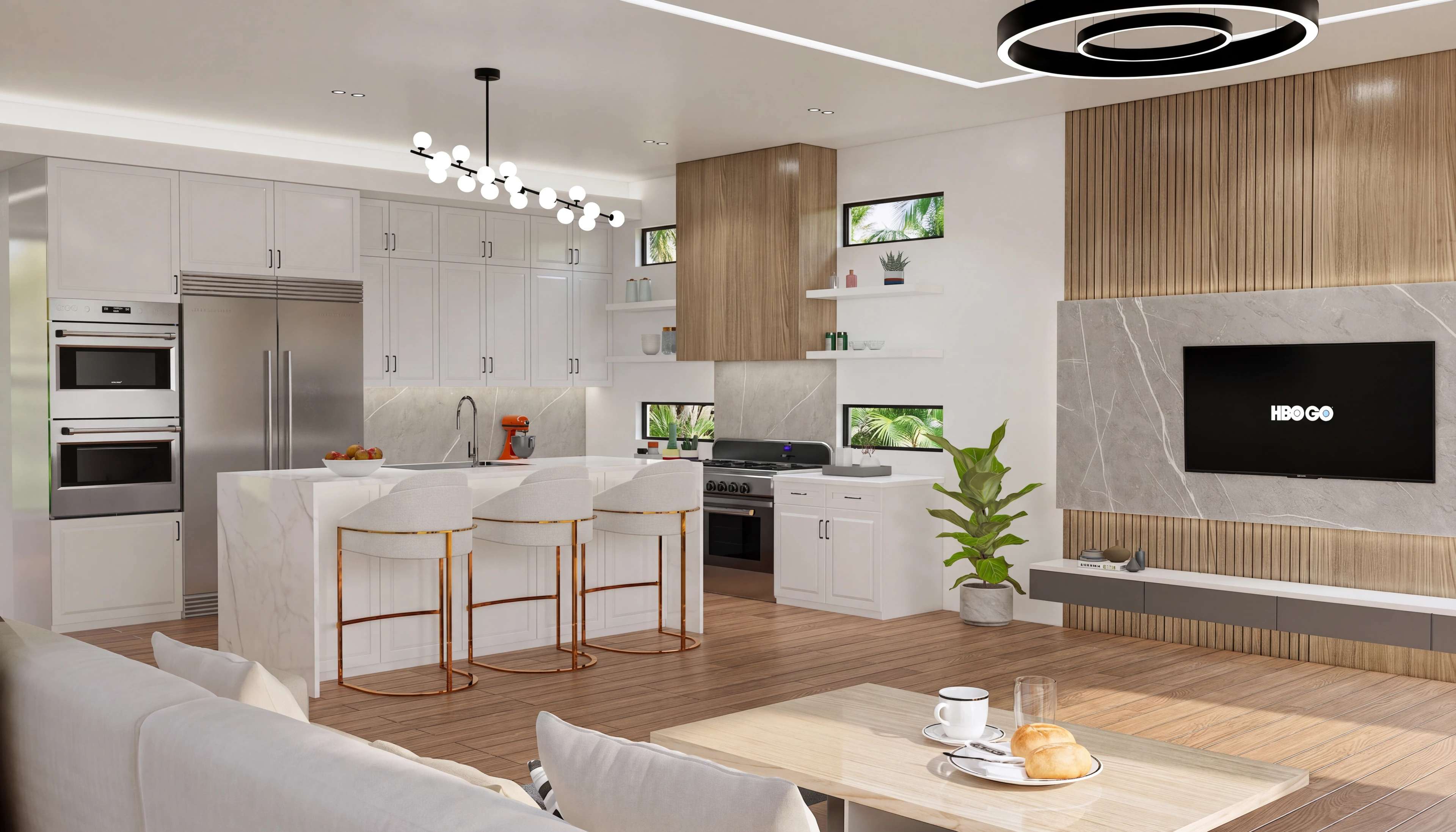 Open living and kitchen area with a stone island and wood feature wall.