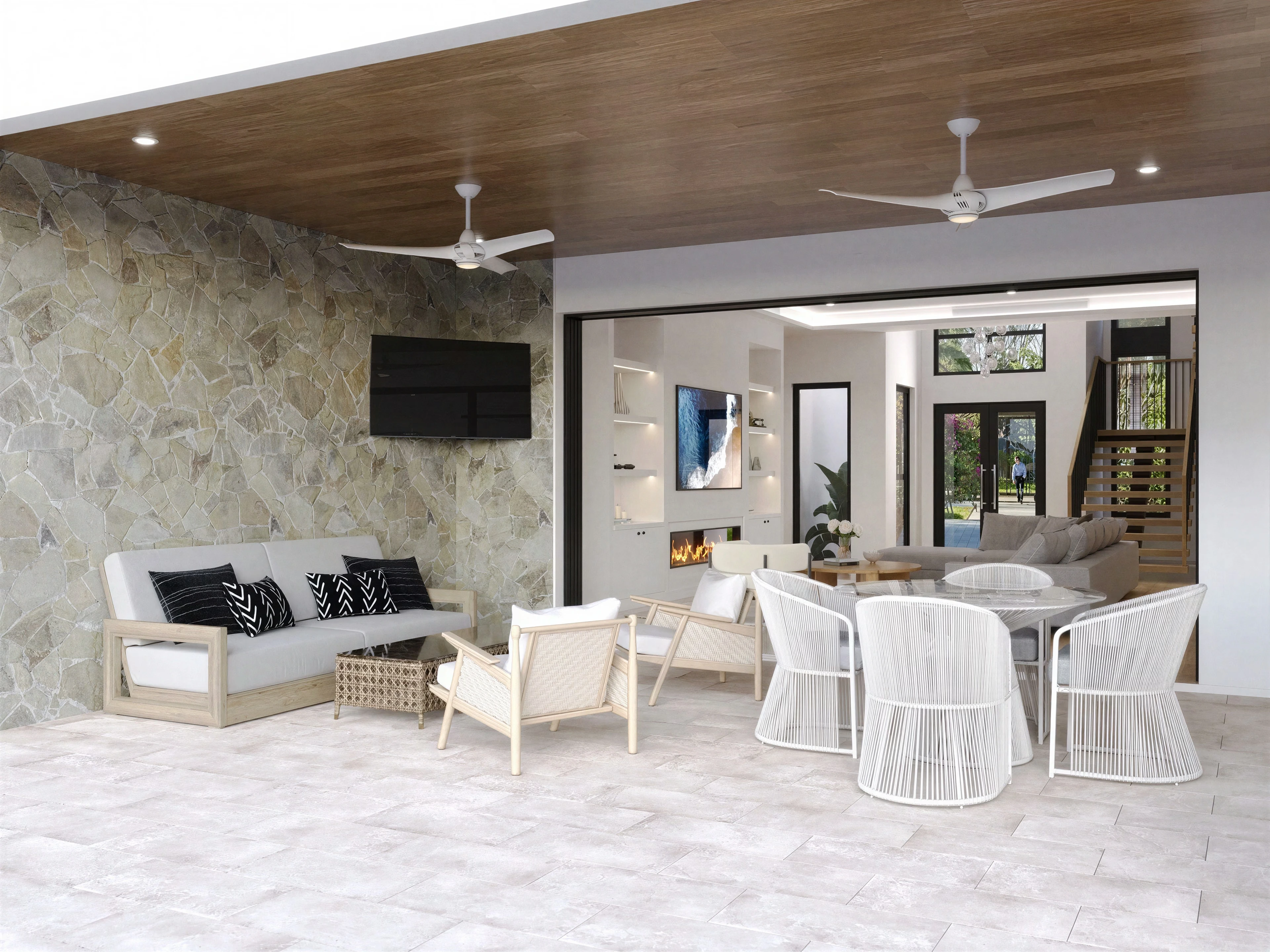Covered outdoor living area with a dining table and lounge seating.