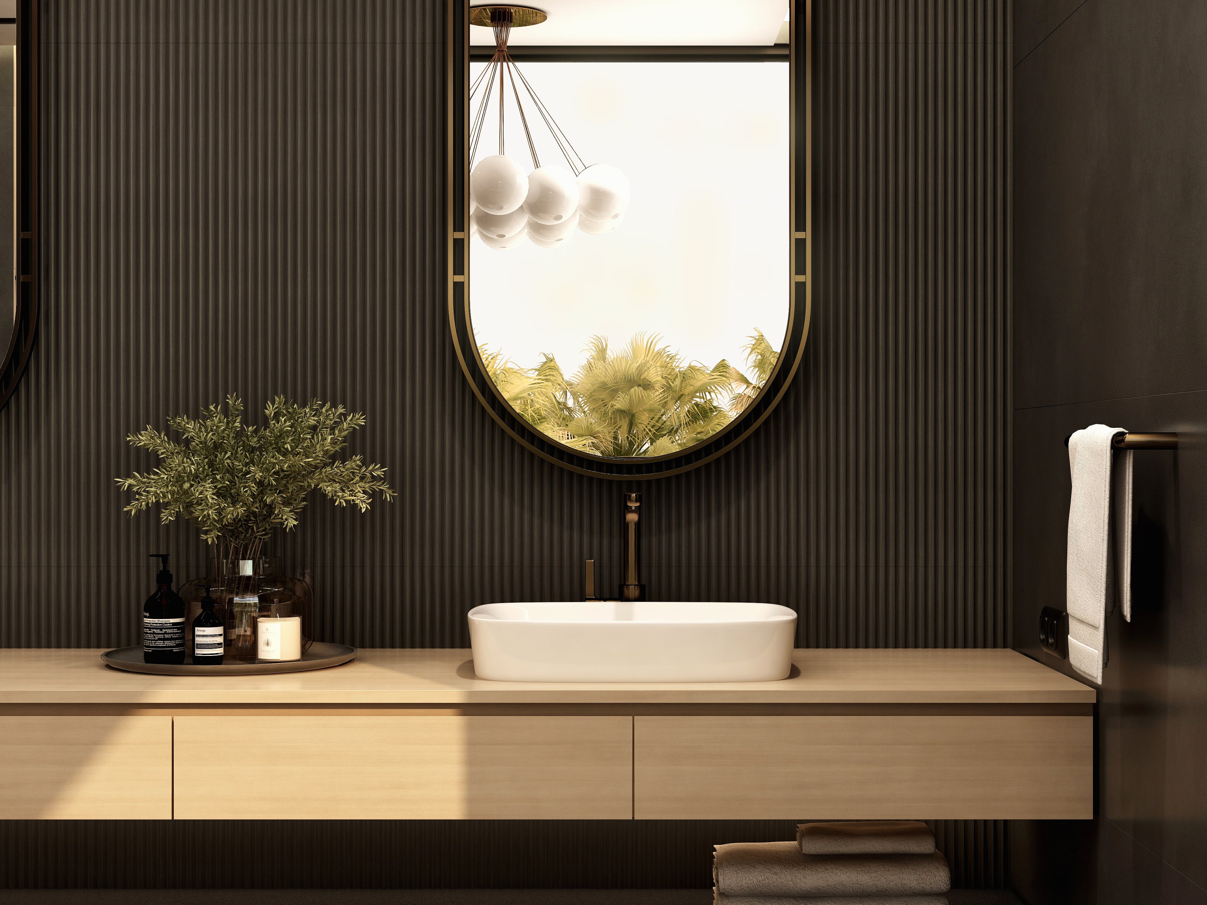 Wood-toned vanity with a vessel basin and oval mirror.