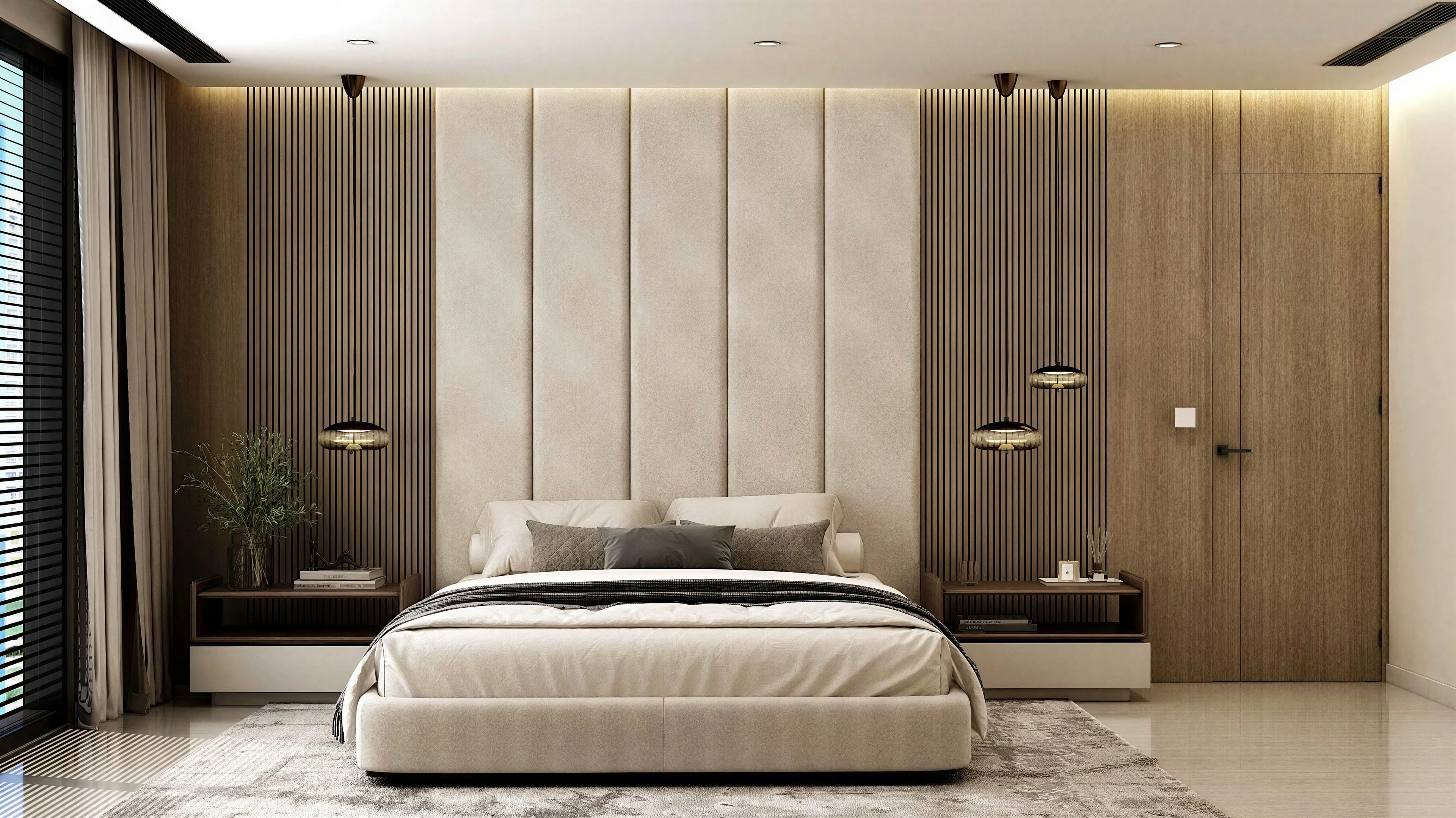 Bedroom with a tall upholstered headboard and paired bedside tables.