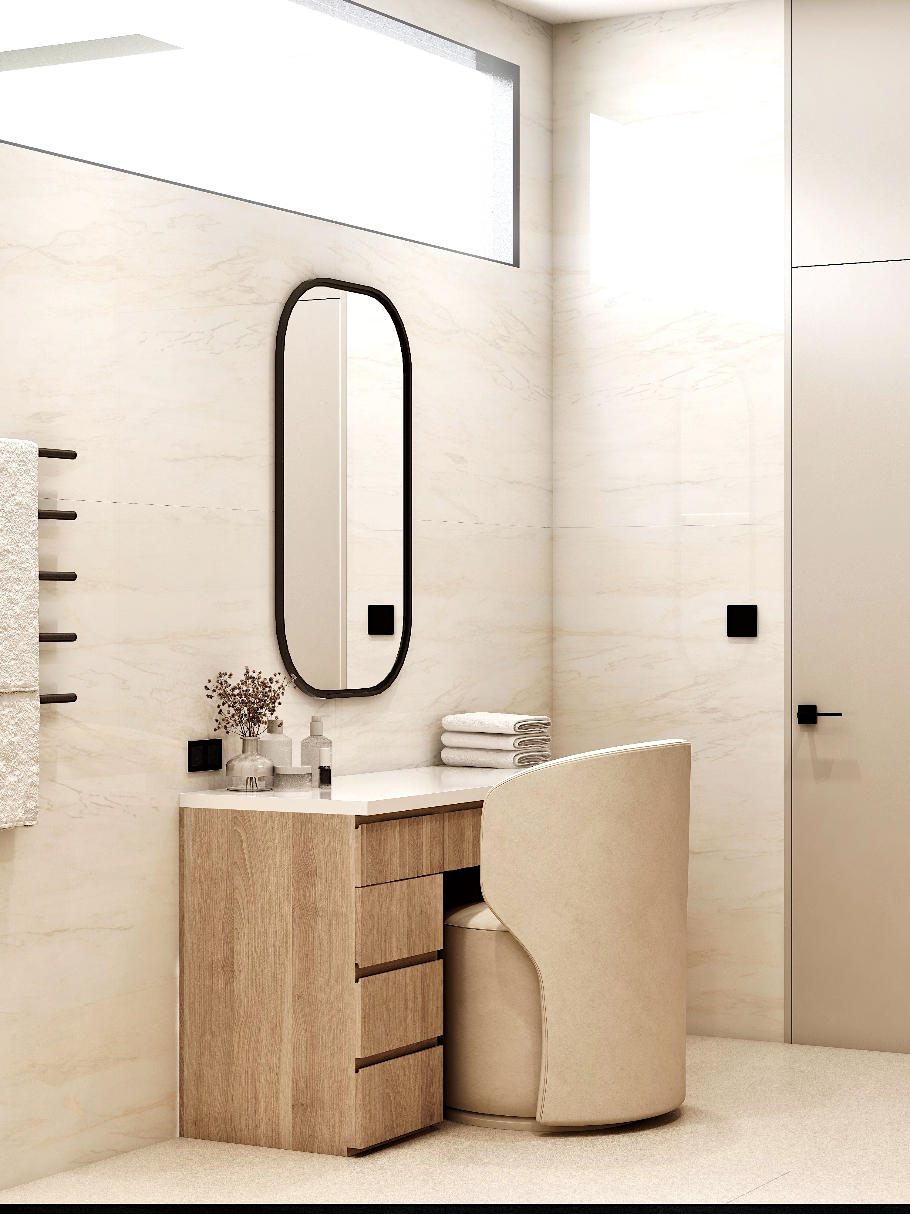 Compact bathroom vanity with a tall oval mirror.