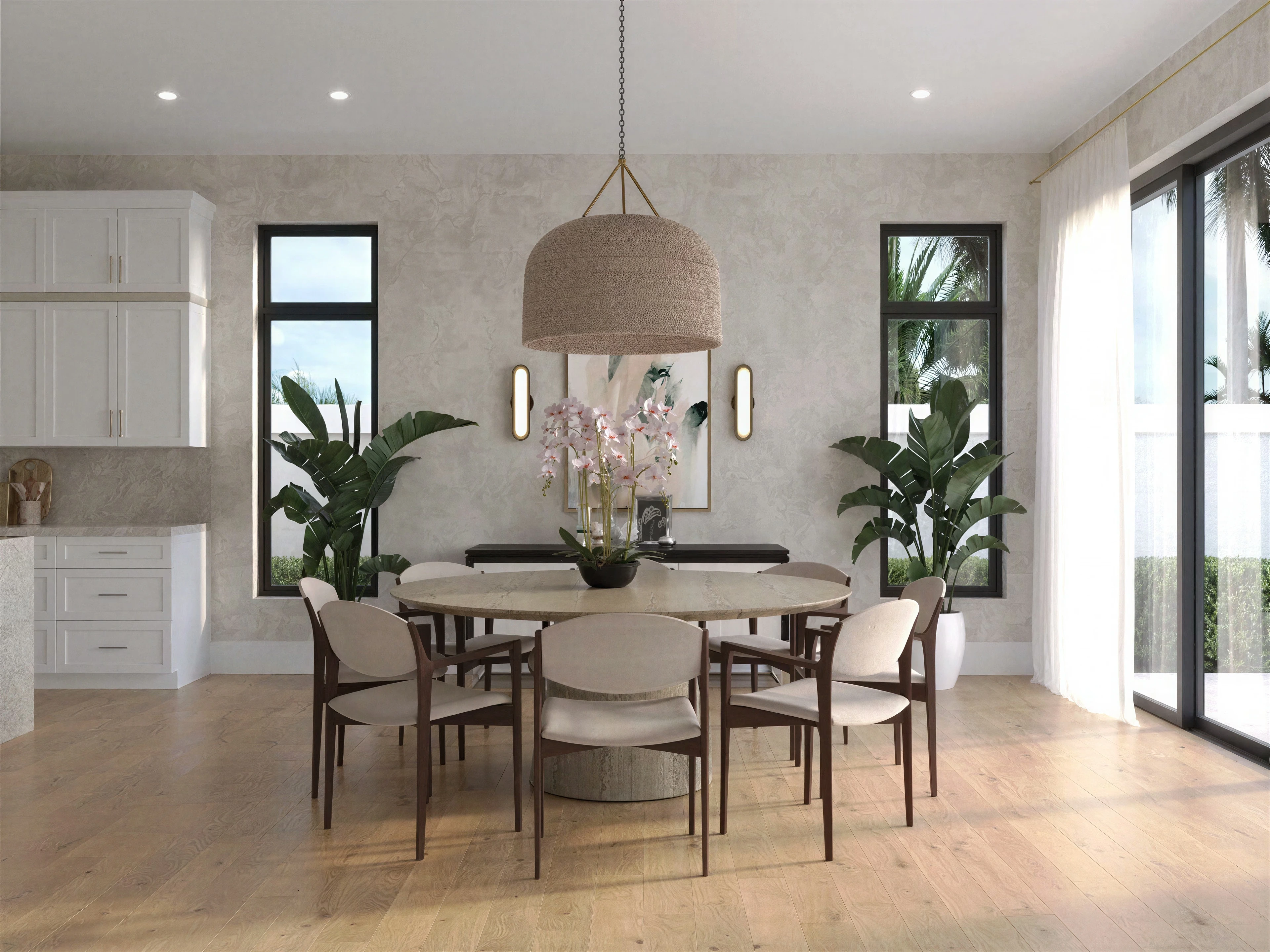 Dining area with a round table and upholstered chairs.