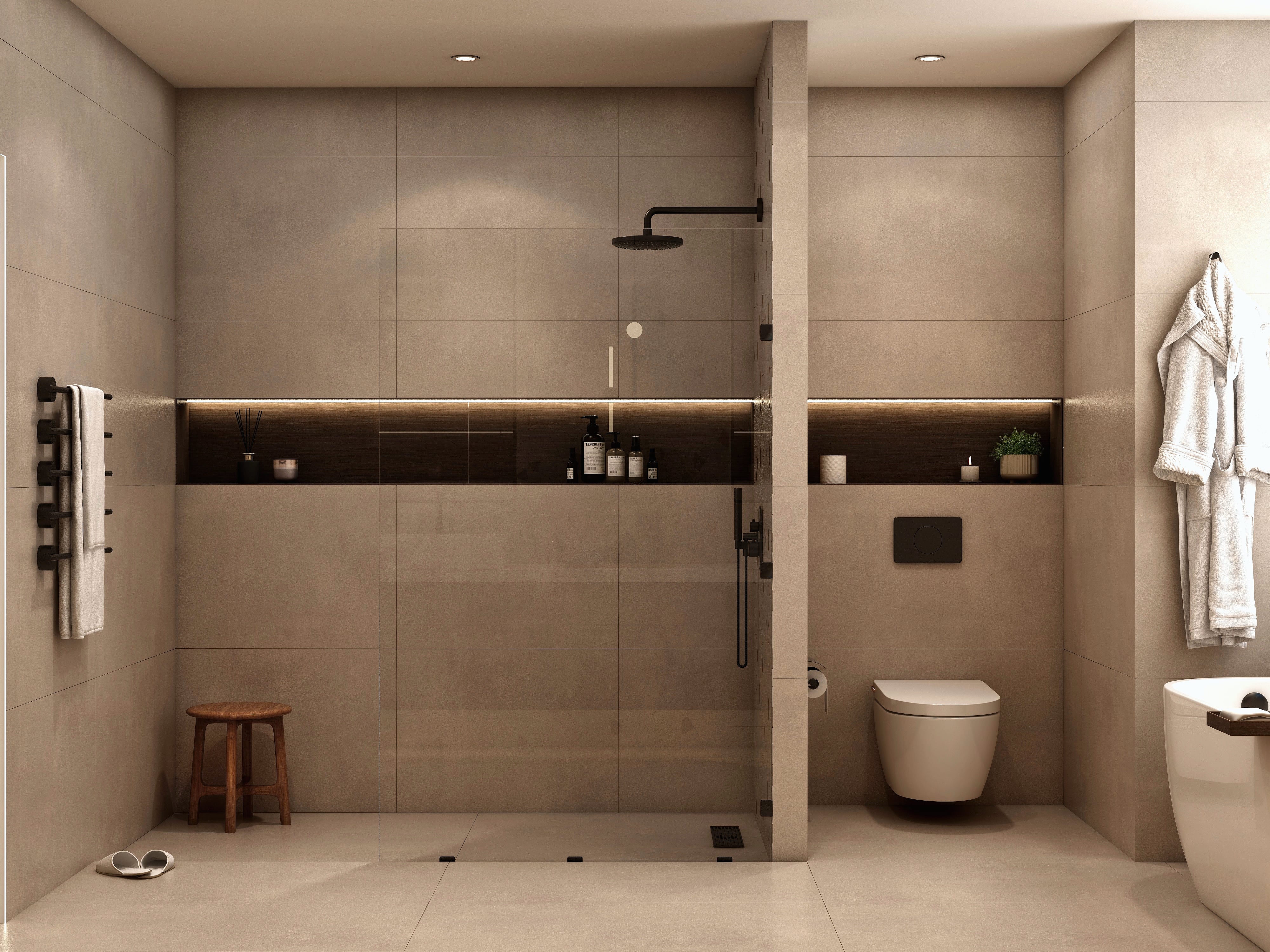 Shower and toilet area with pale tiled walls.