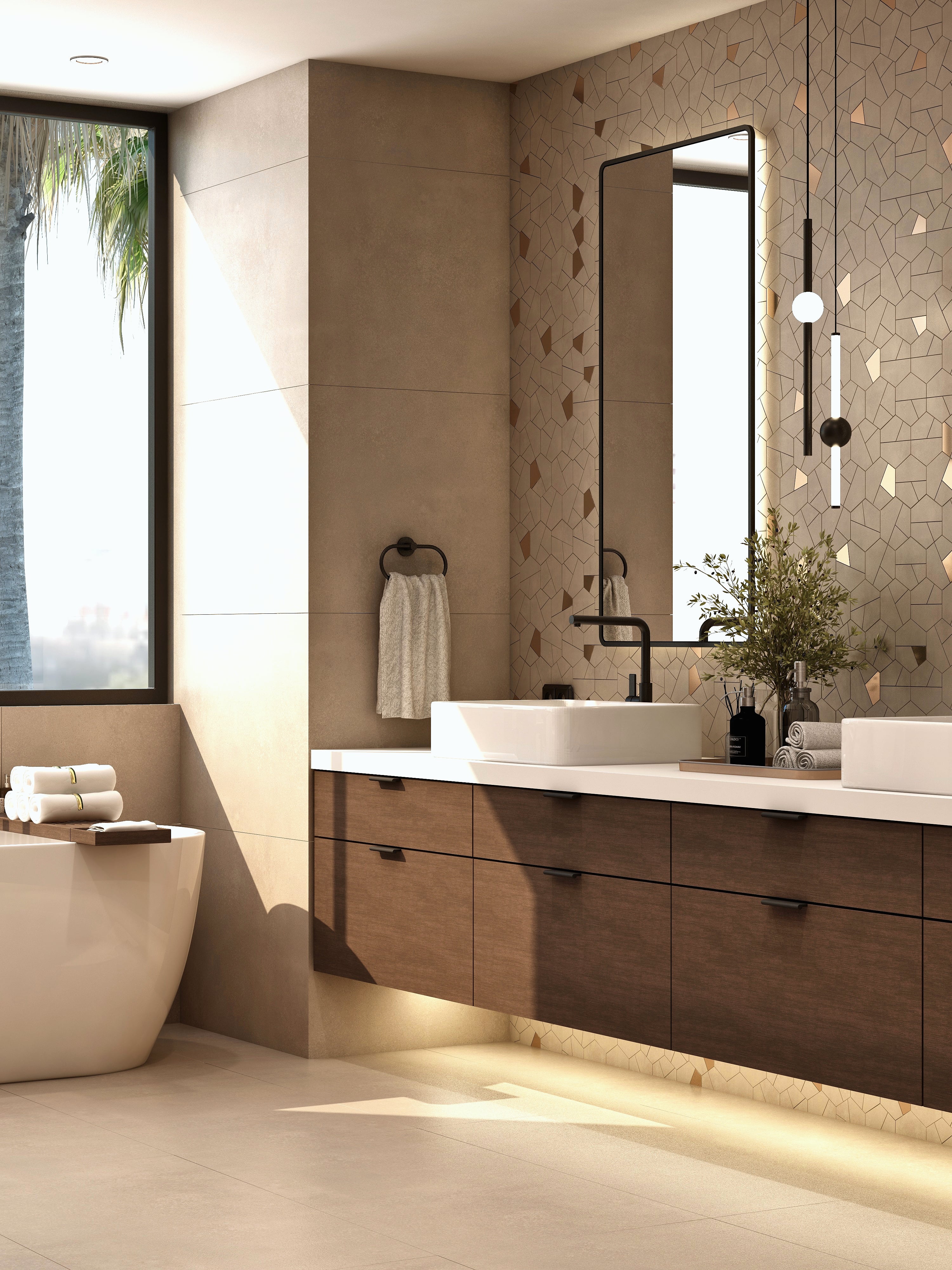 Bathroom vanity and freestanding tub beside a large window.