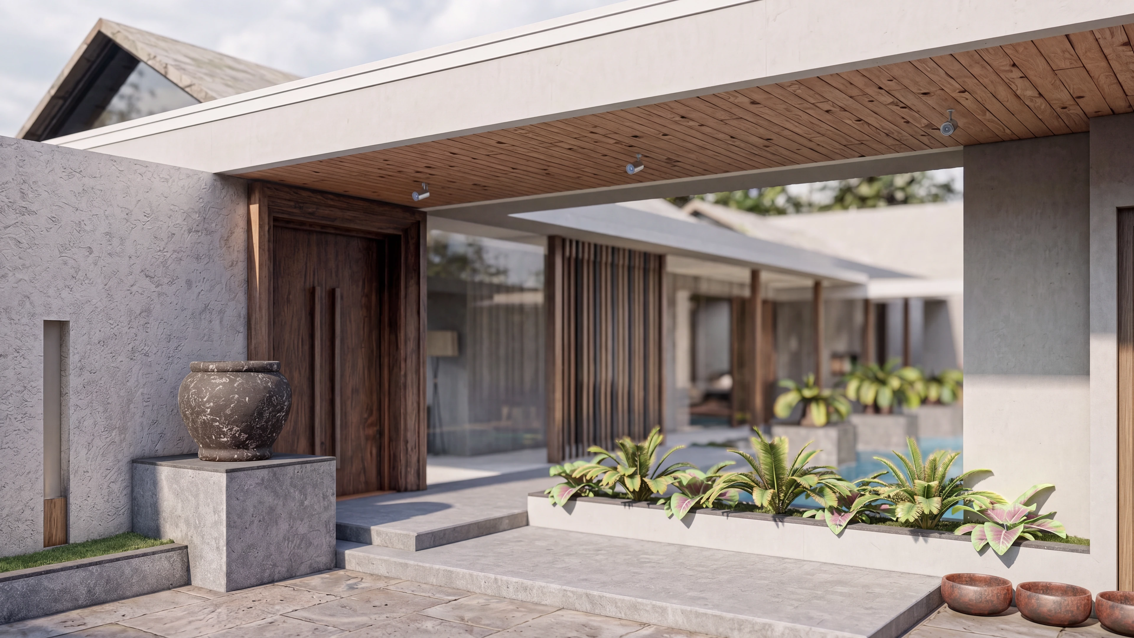 Covered entry with a wood ceiling and landscaped beds.