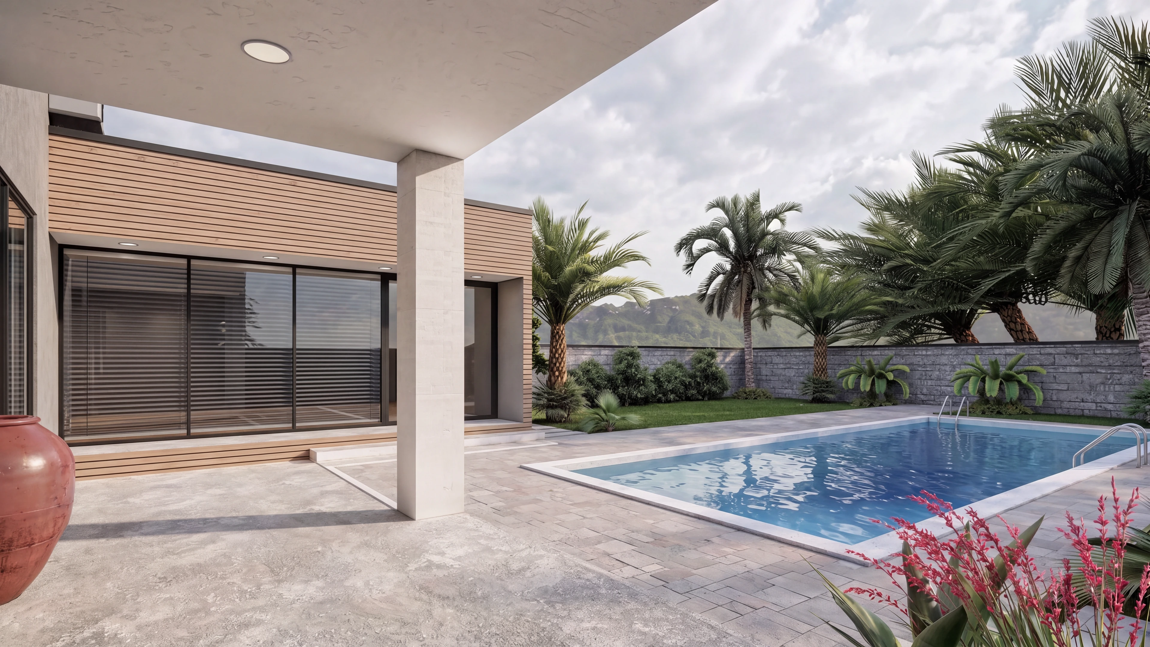 Covered terrace opening onto the pool and planted garden.