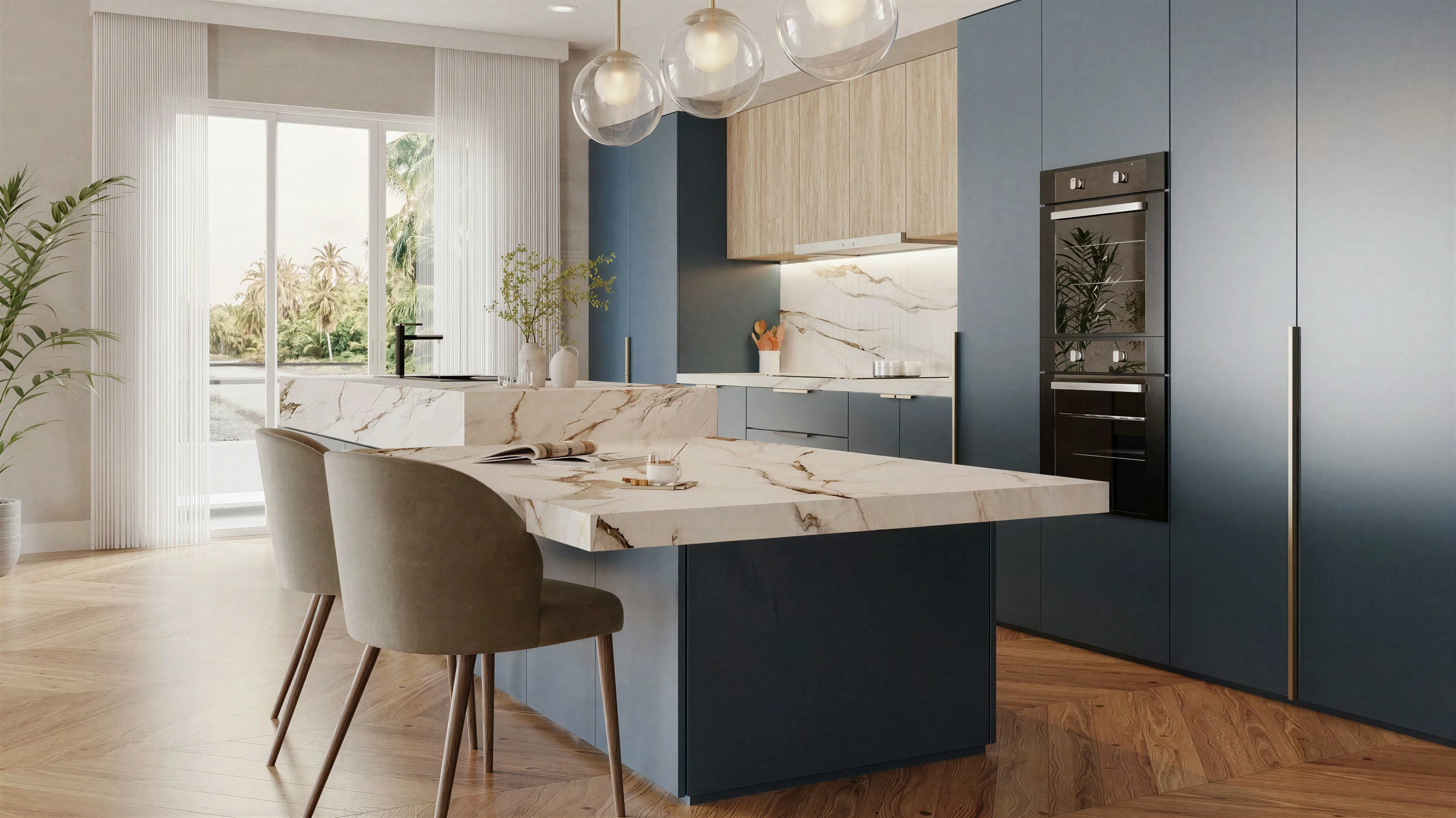 Wide kitchen view with navy cabinetry, a veined stone island and globe pendants.