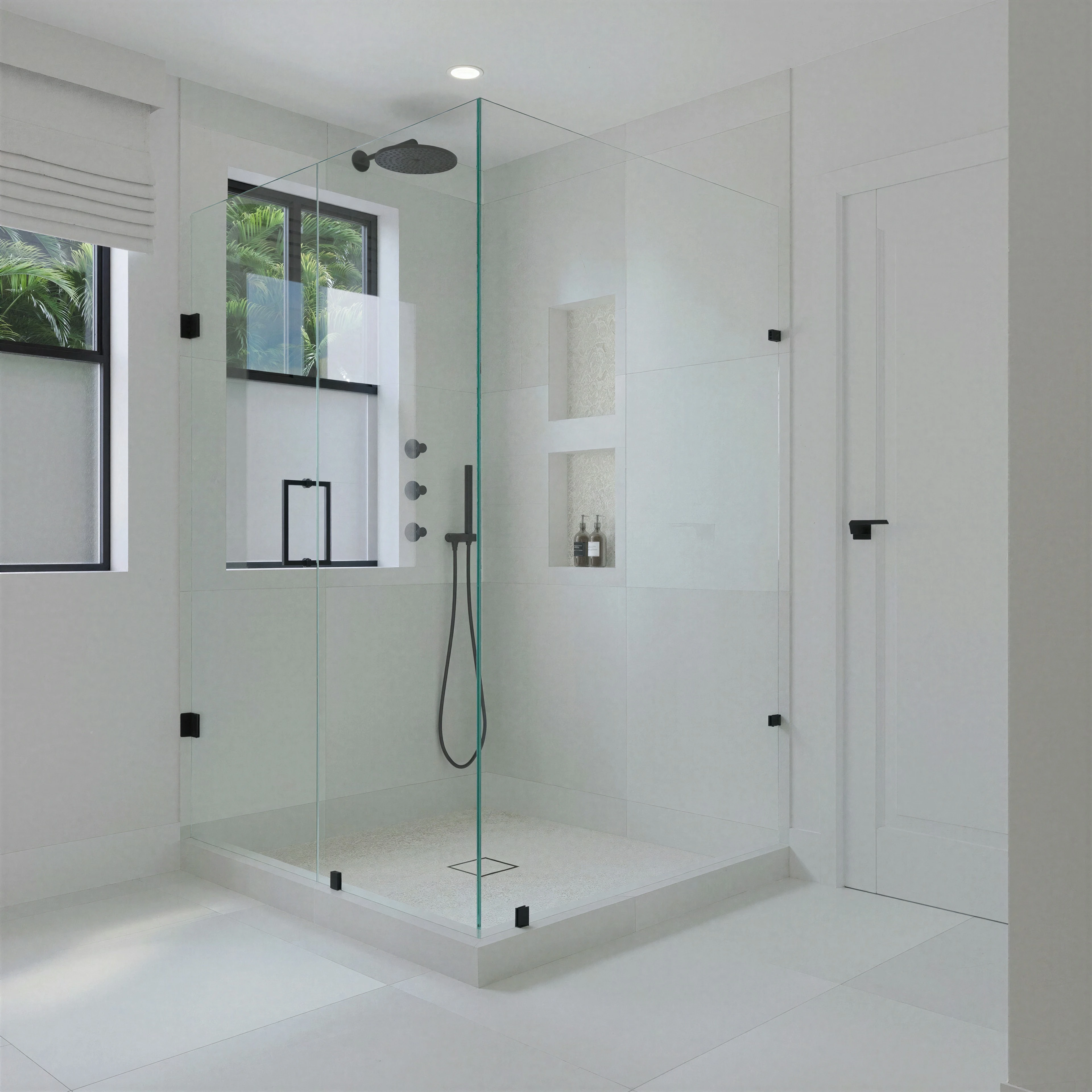 Glass shower enclosure with pale tiled walls.