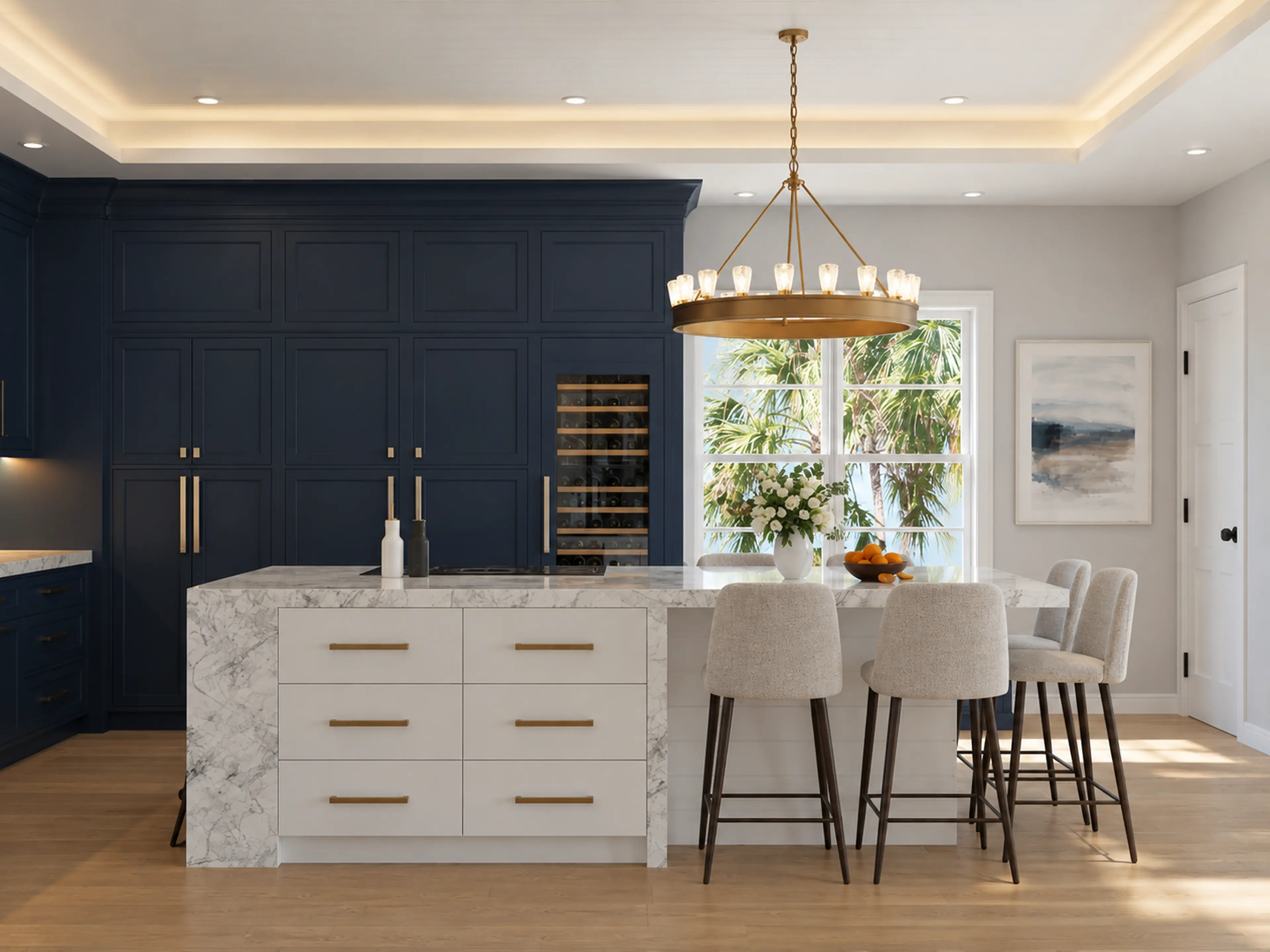 Photographic navy kitchen with a marble island and brass chandelier.