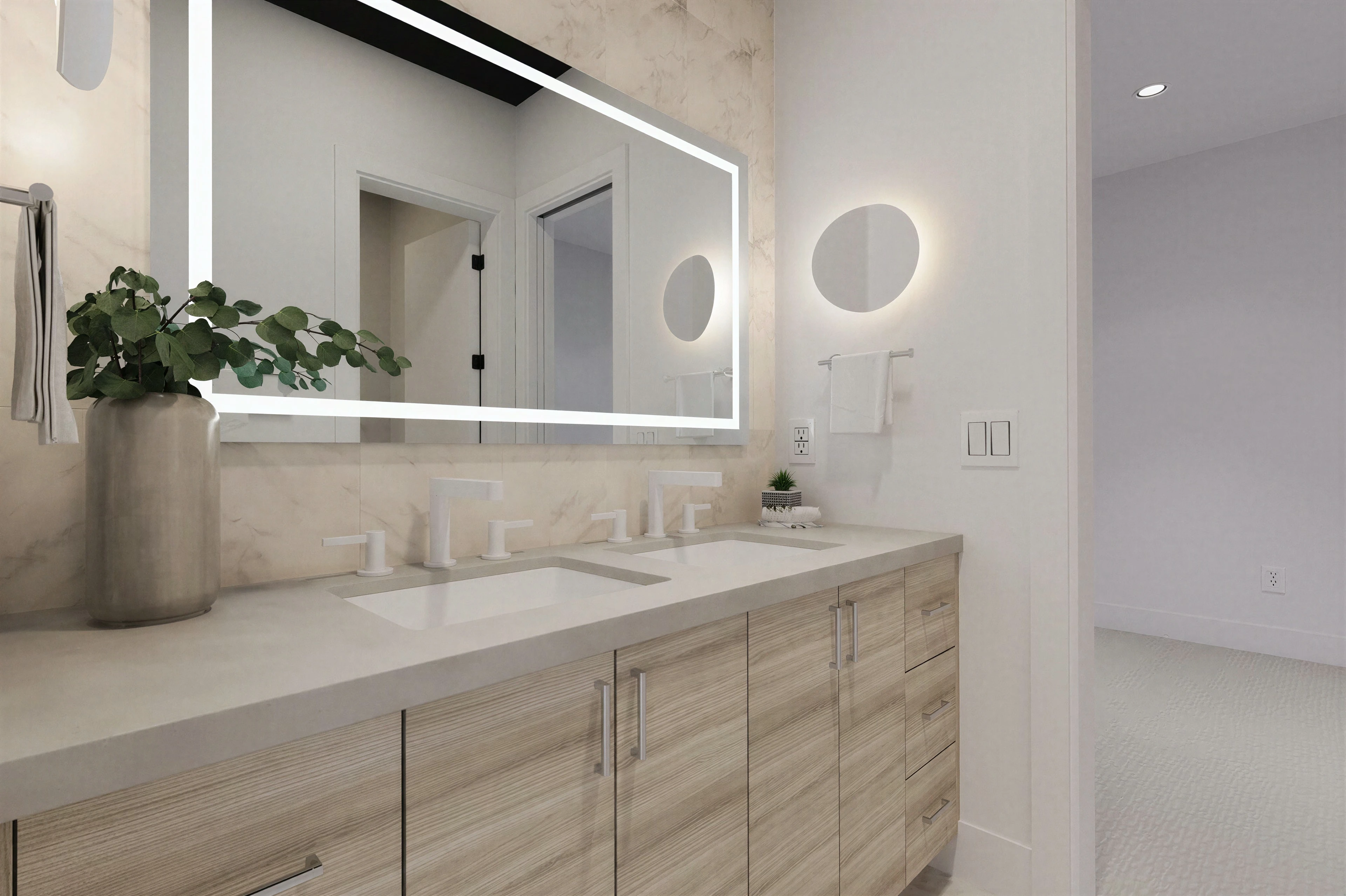 Bathroom vanity with an illuminated mirror.