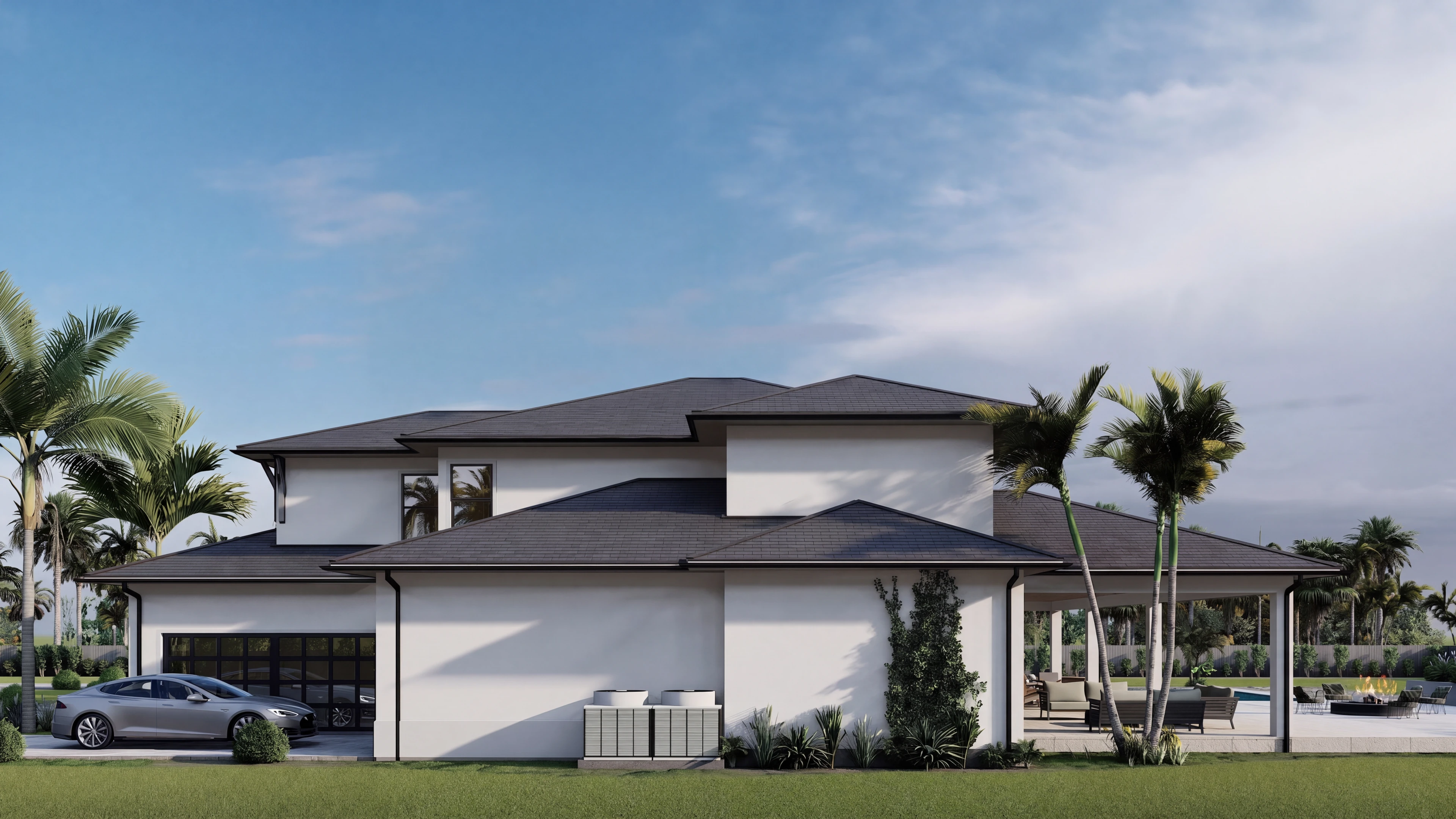 Garage-side elevation with a driveway and landscaped beds.