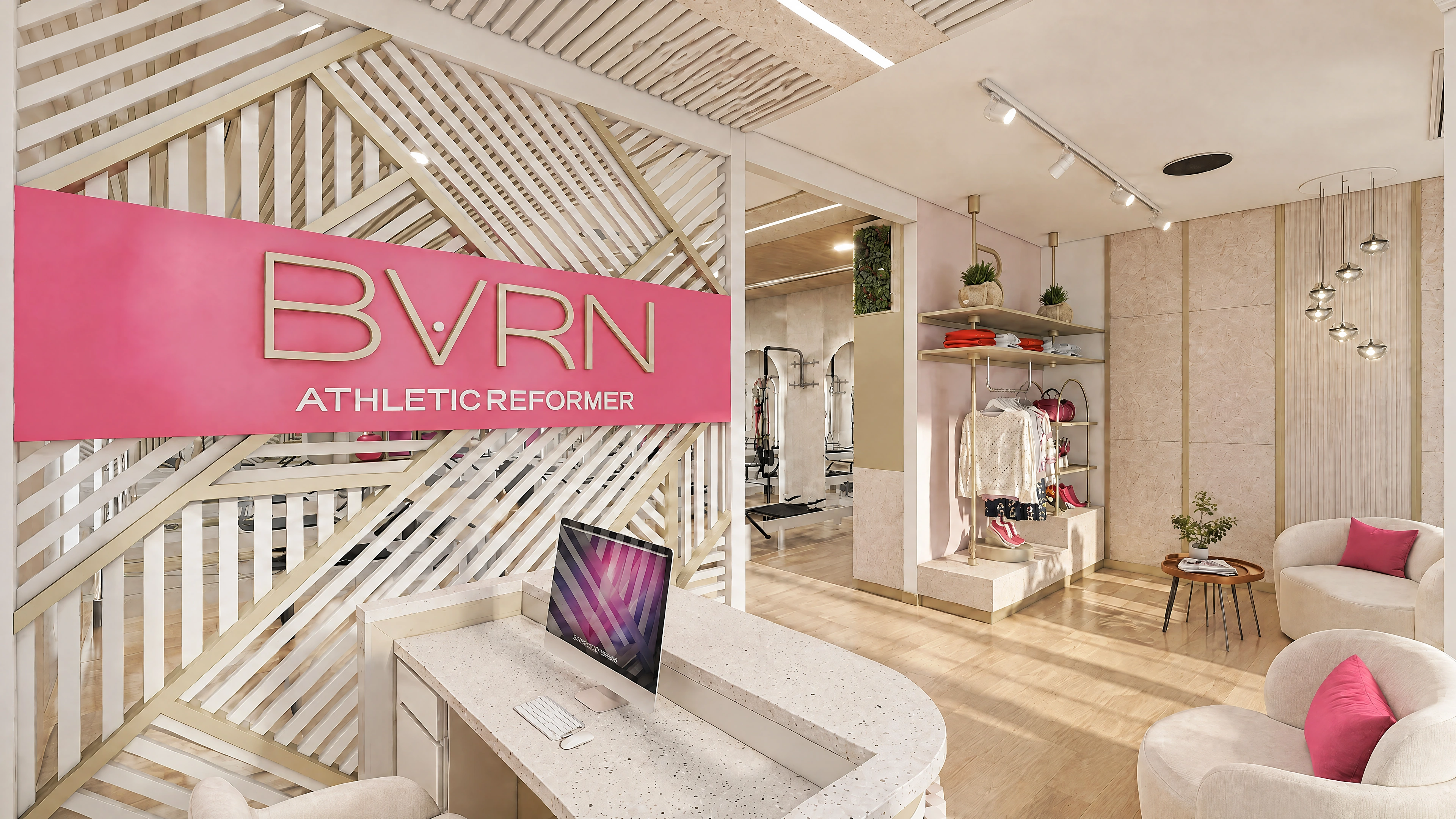 Pilates studio reception and retail area with a patterned feature wall.