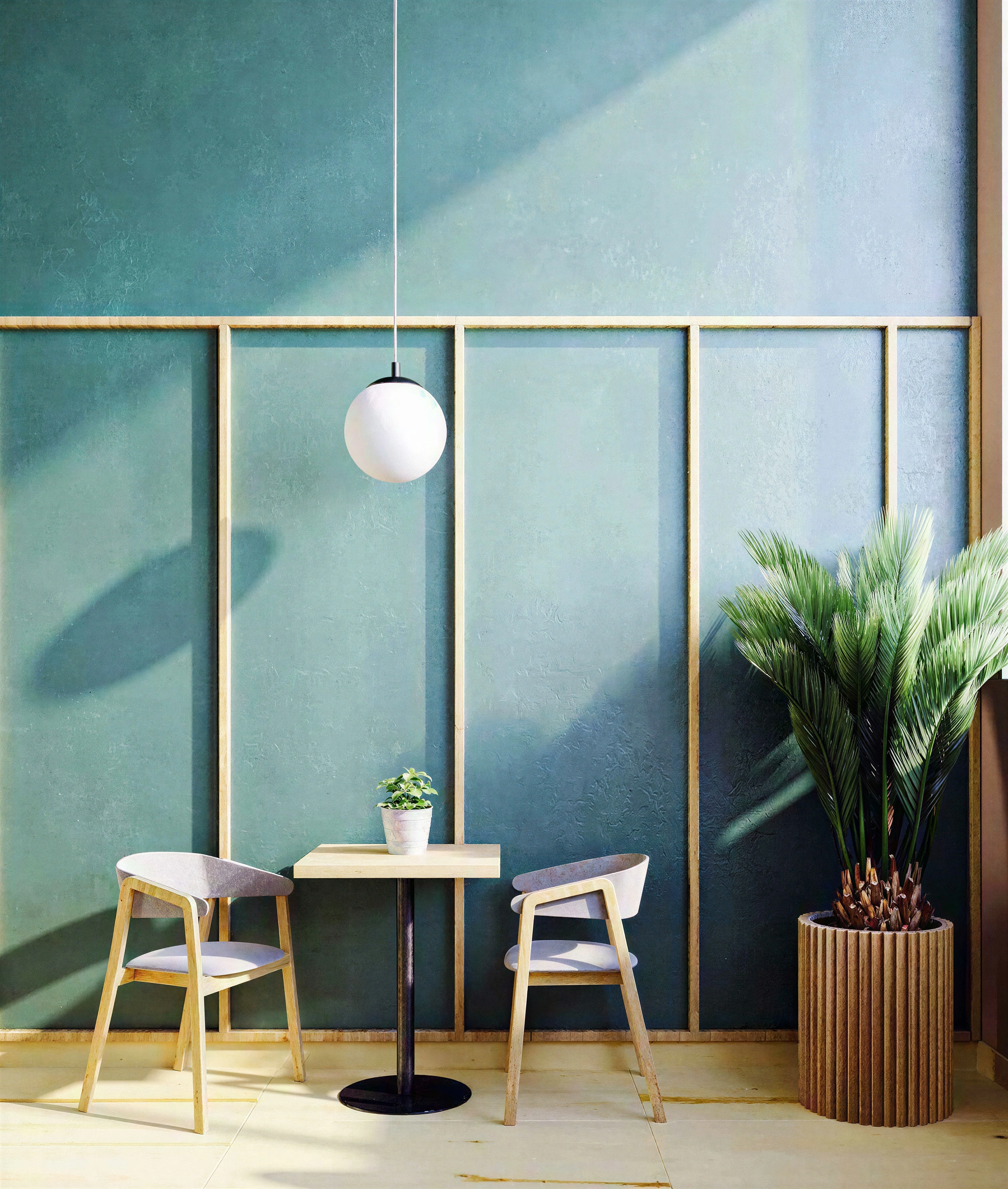 Small restaurant seating area beside a teal wall and large plant.