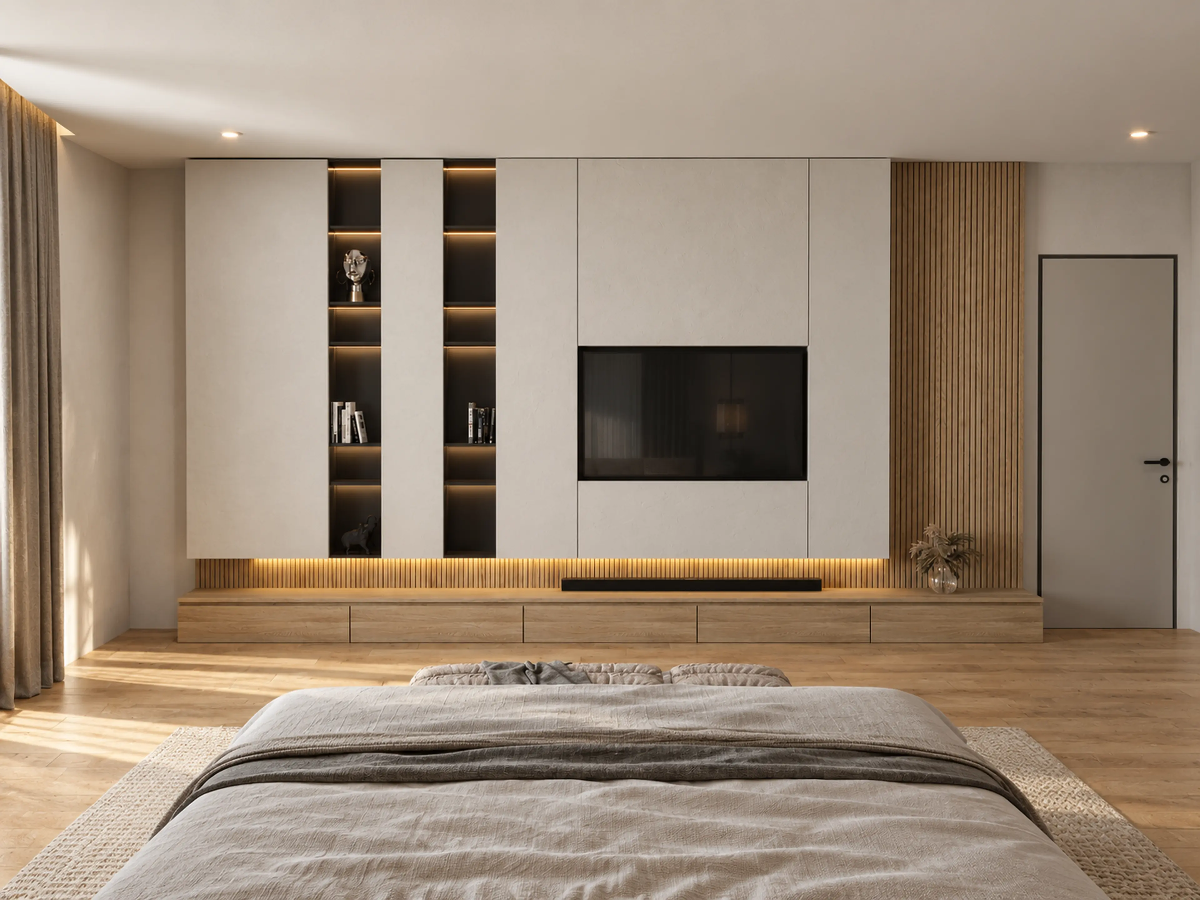 Photographic bedroom view toward the media wall and illuminated shelving.